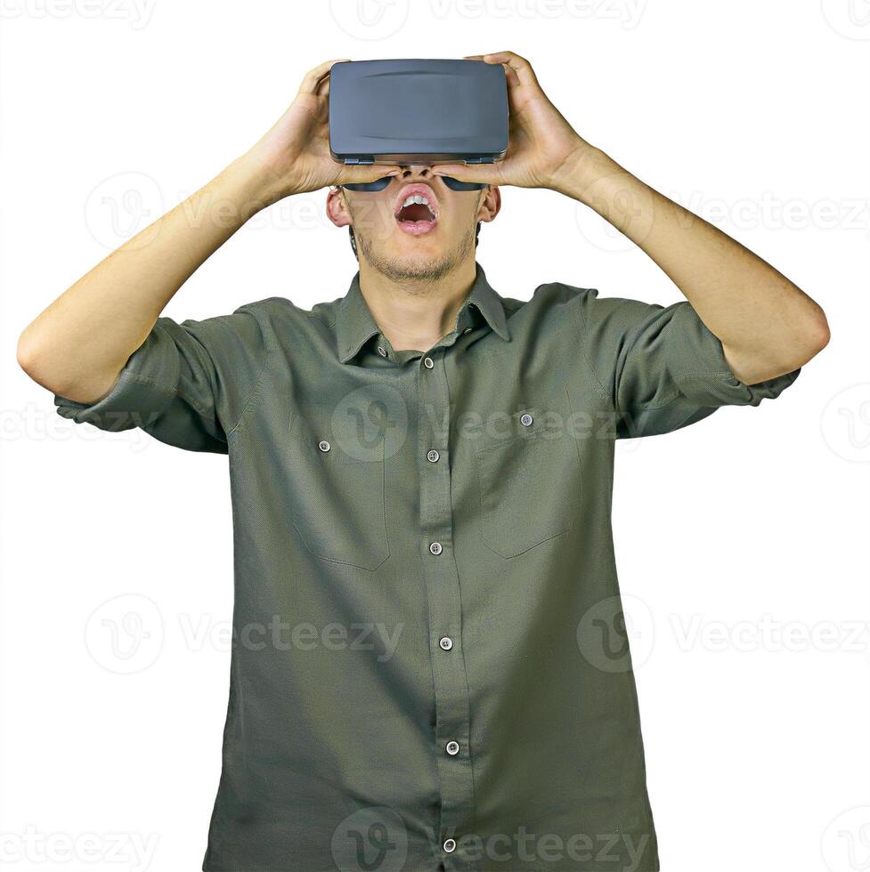 Young man in shirt enjoys and amazed by virtual reality glasses in front of white isolated background photo