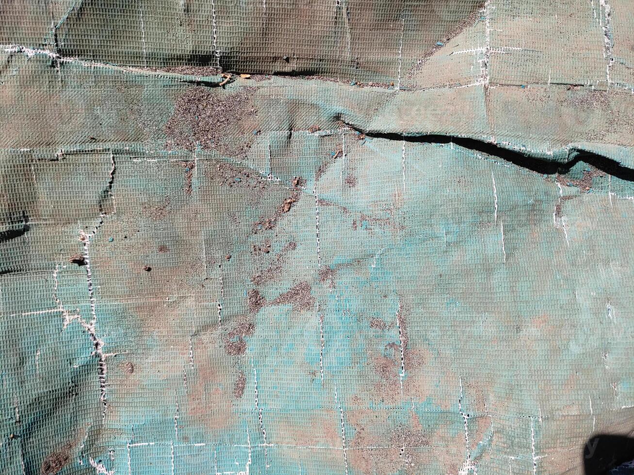 texture of old plastic tarpaulin photo