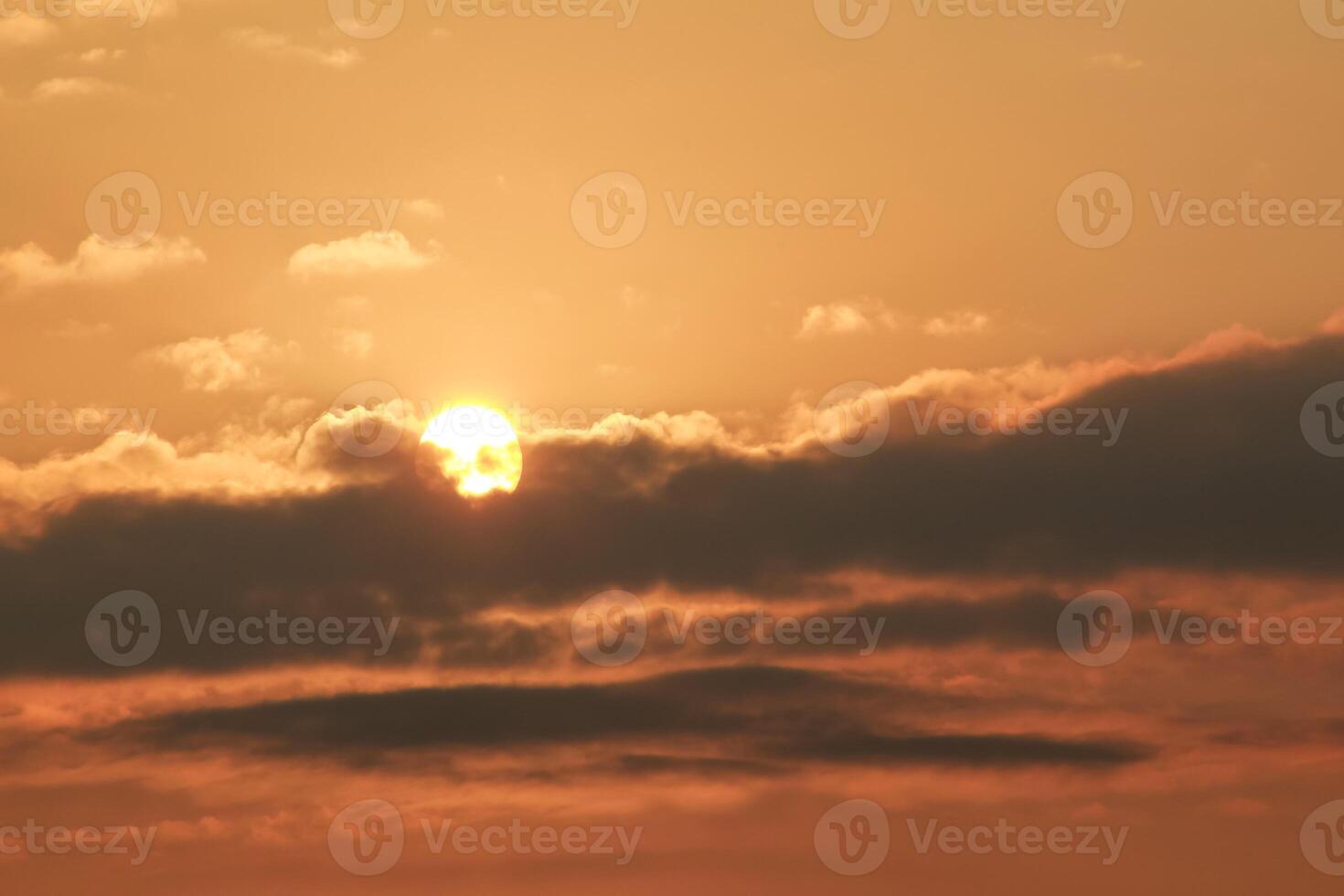 Close up view of sun hidden behind clouds photography photo