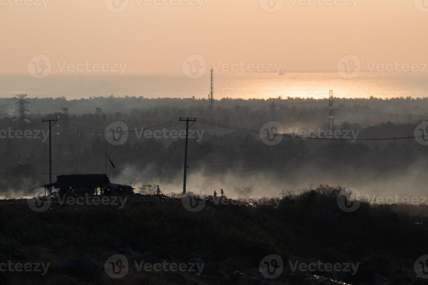 Misty morning atmosphere in Pekosong village, Lombok, Indonesia photo