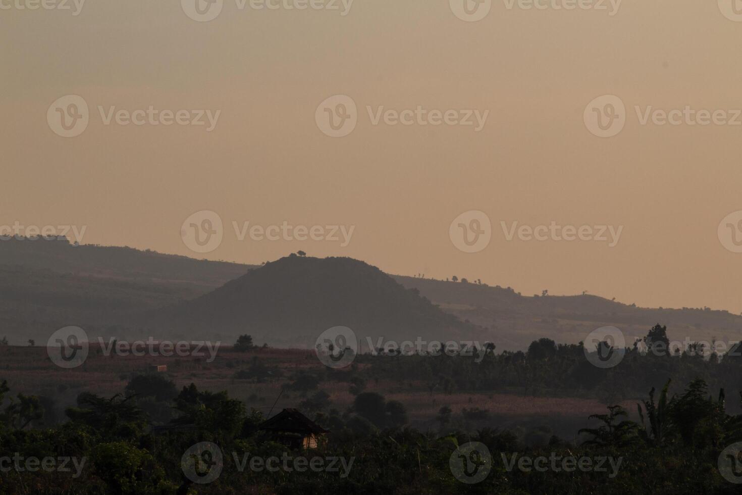 Misty morning atmosphere in Pekosong village, Lombok, Indonesia photo