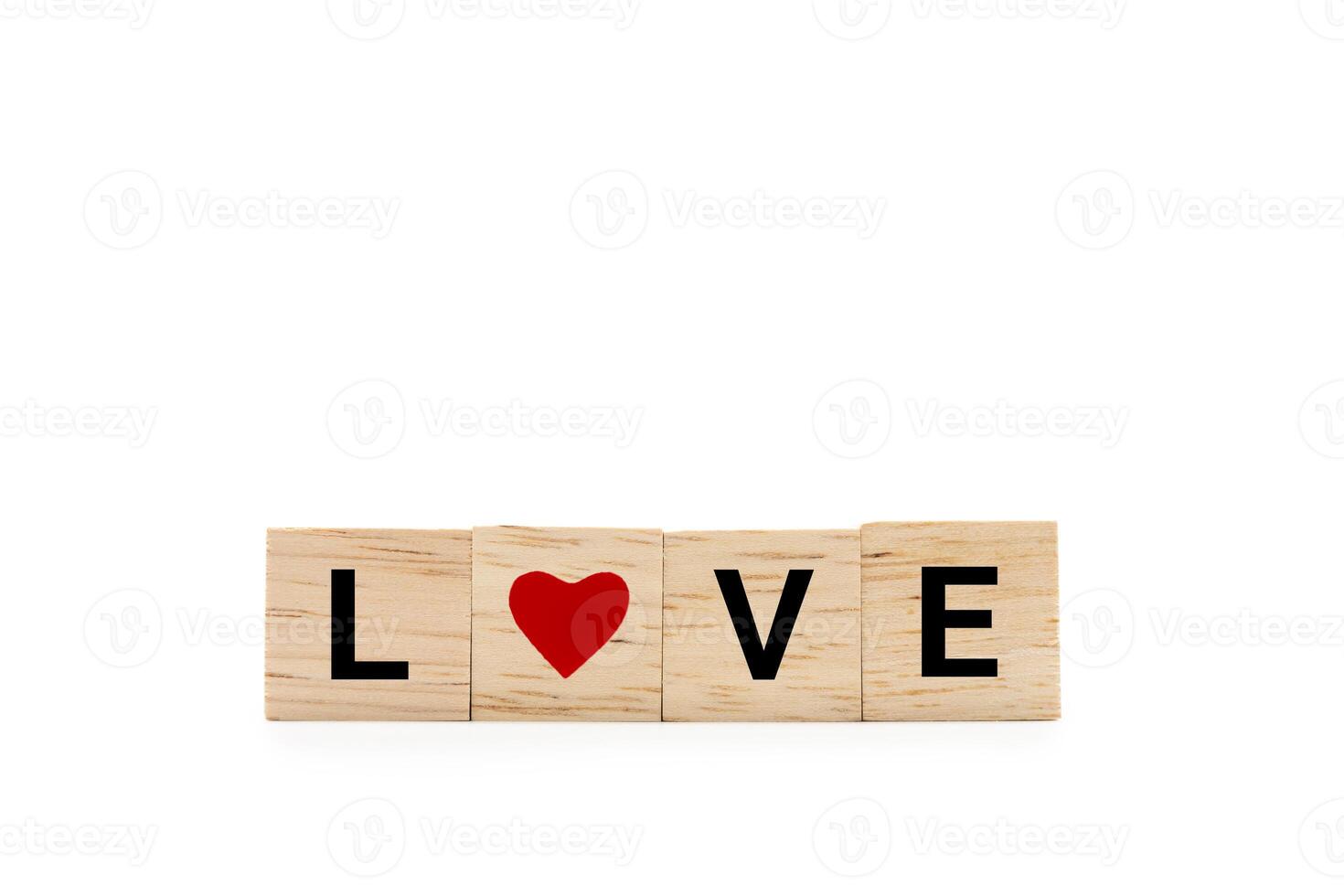 Hand place wooden blocks with LOVE text and red heart isolated on white background. Love symbol with copy space and clipping path. photo