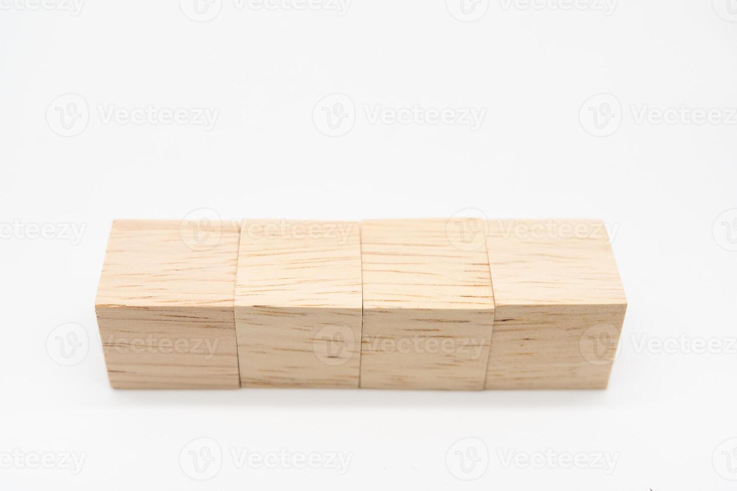 Four blank wooden blocks isolated on white background. Empty wooden cubes for text. Copy space. photo