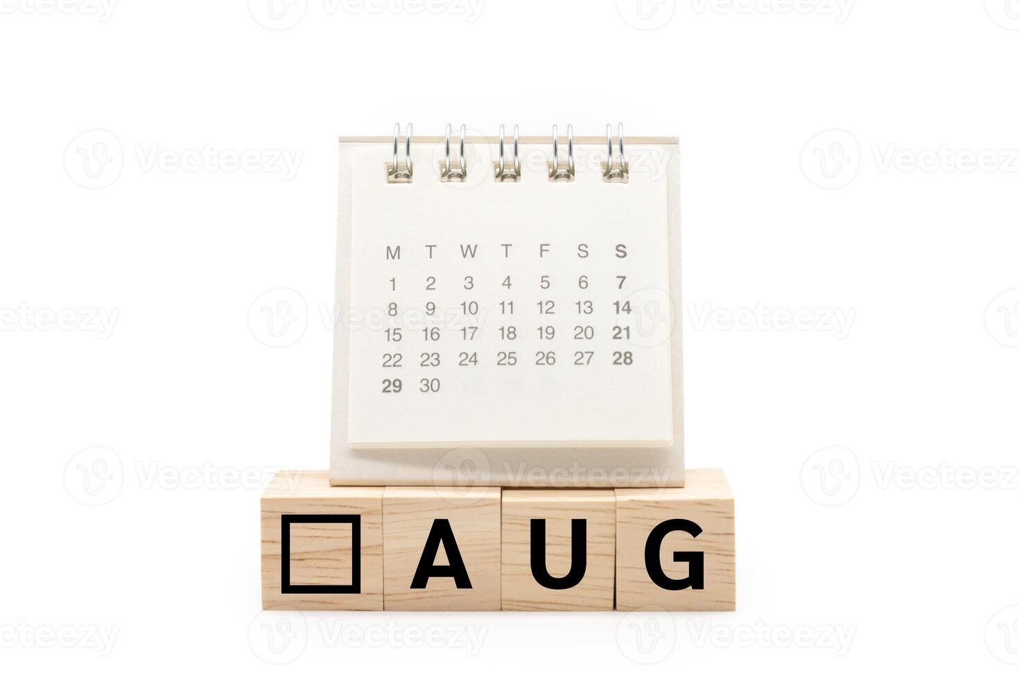 Calendar on Wooden blocks with AUG text isolated on white background. August and Calendar concept. Copy space. photo