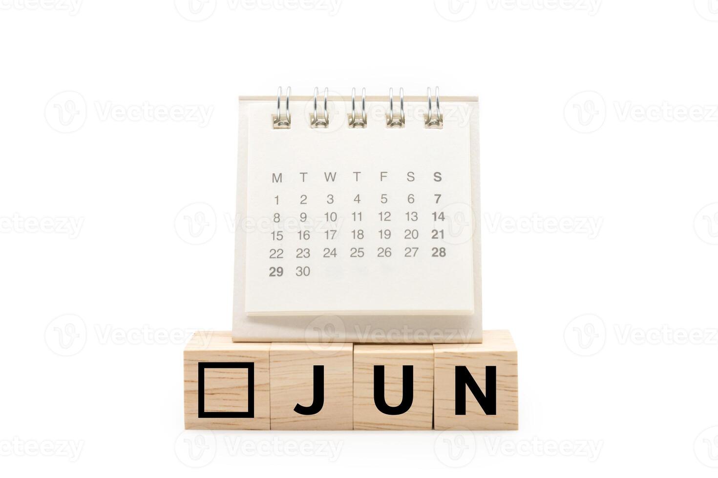 Calendar on Wooden blocks with JUN text isolated on white background. June and Calendar concept. Copy space. photo
