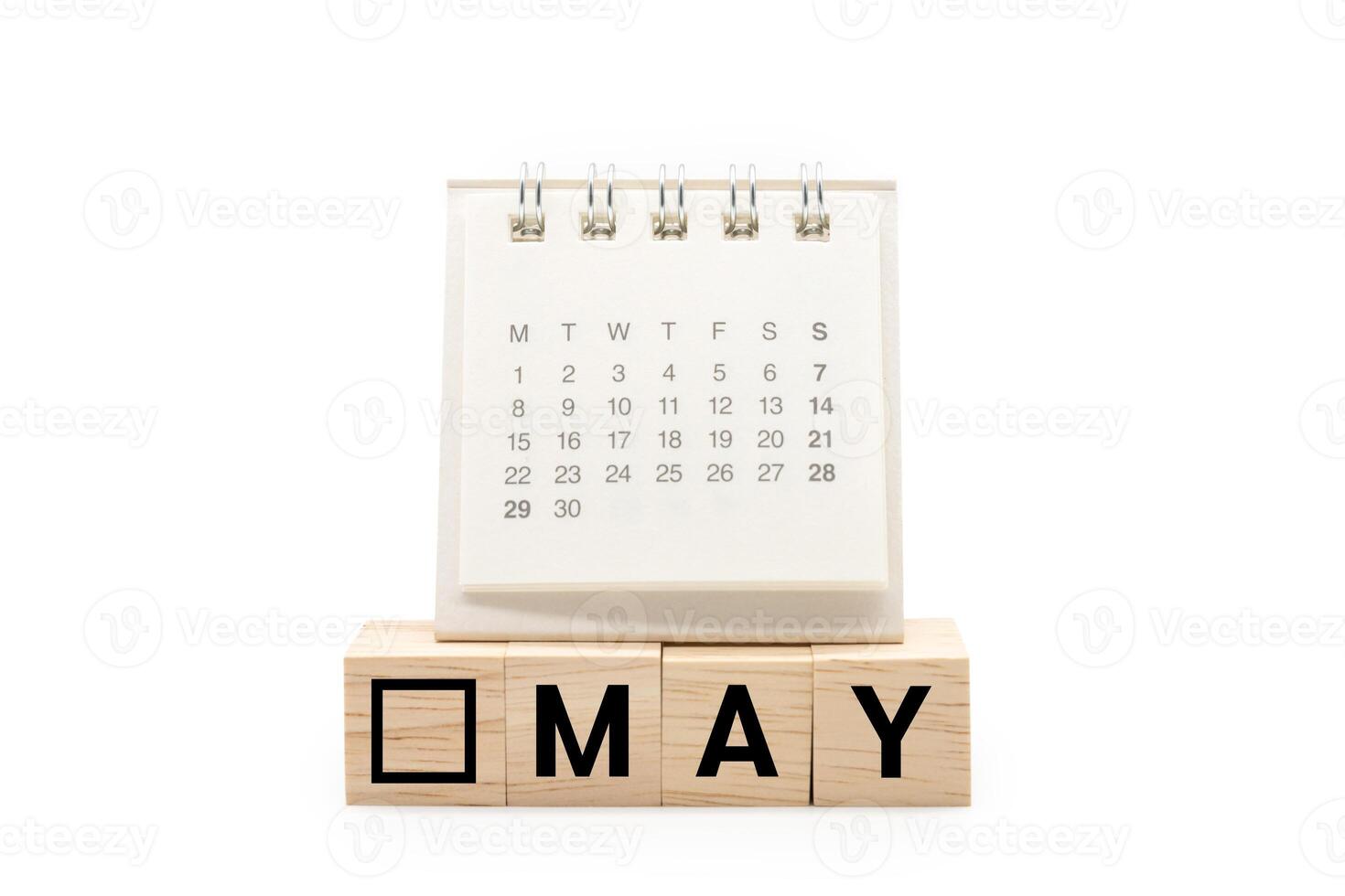 Calendar on Wooden blocks with MAY text isolated on white background. MAY and Calendar concept. Copy space. photo