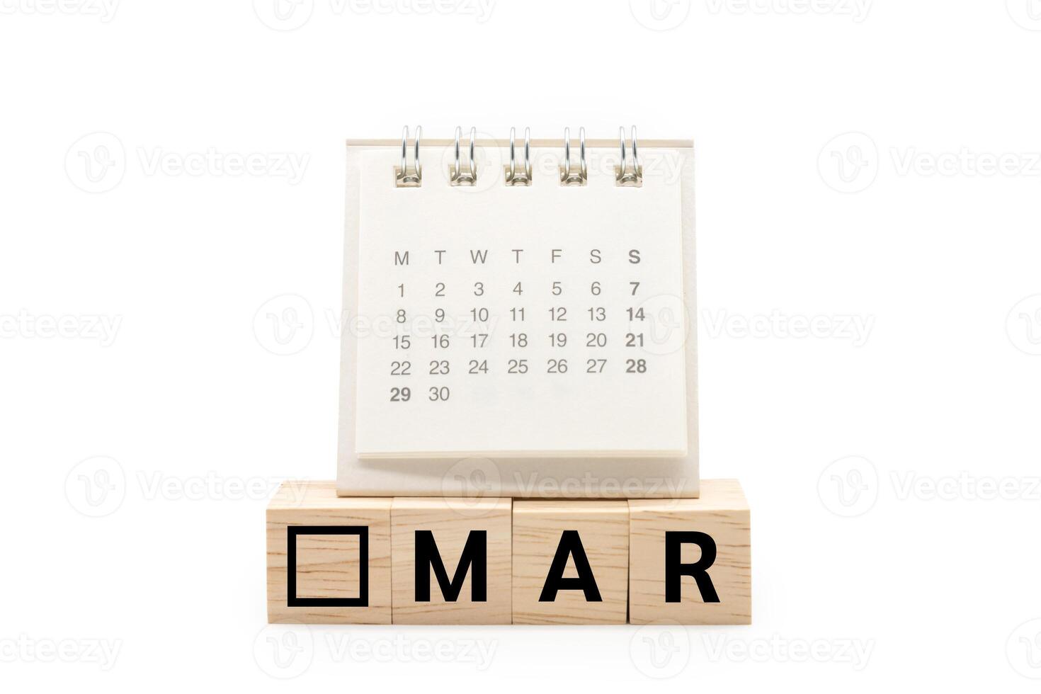 Calendar on Wooden blocks with MAR text isolated on white background. March and Calendar concept. Copy space. photo