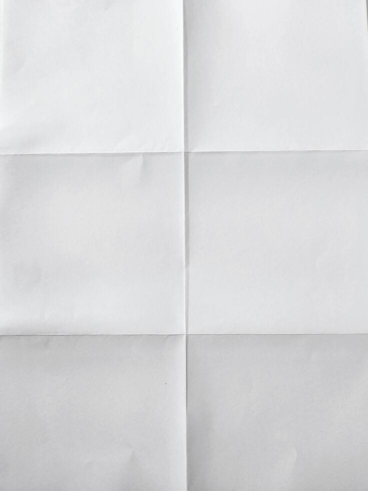 white textured sheet of paper folded in six photo