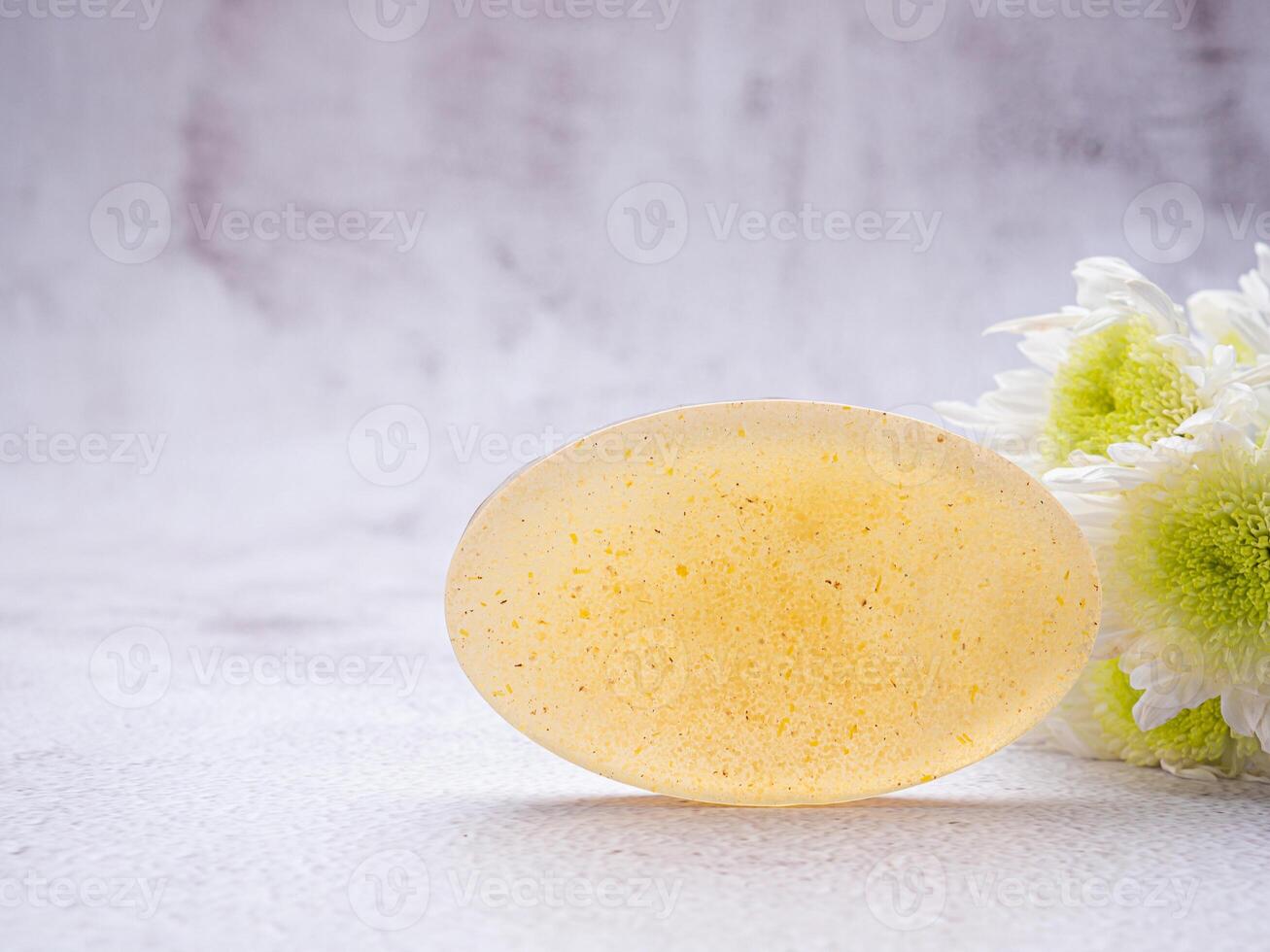 Organic soap homemade with ingredients is honey placed on gray stone background. Soap protection or prevent acne, bacteria in both body, and facial use none allergy. Concept of healthcare photo