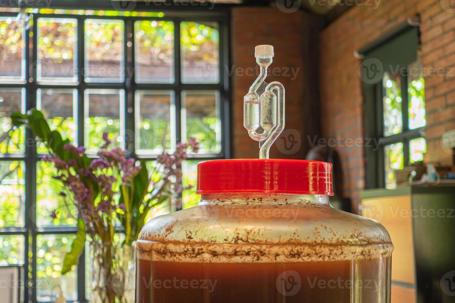 Close-up of craft beer and foam in a fermentation container. photo