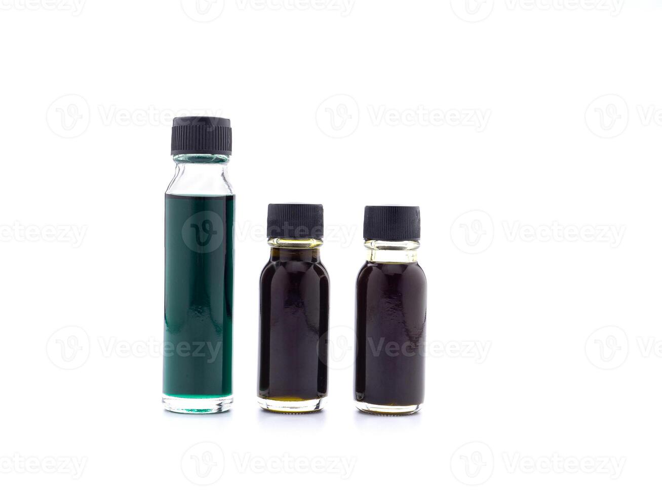 The essential oil in bottles placed on a white background. Space for text. Side view photo