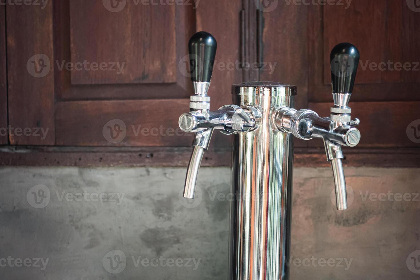 Equipment for pouring beer into a tumbler. Beer taps. Vintage style. Craft beer. Alcohol concept photo
