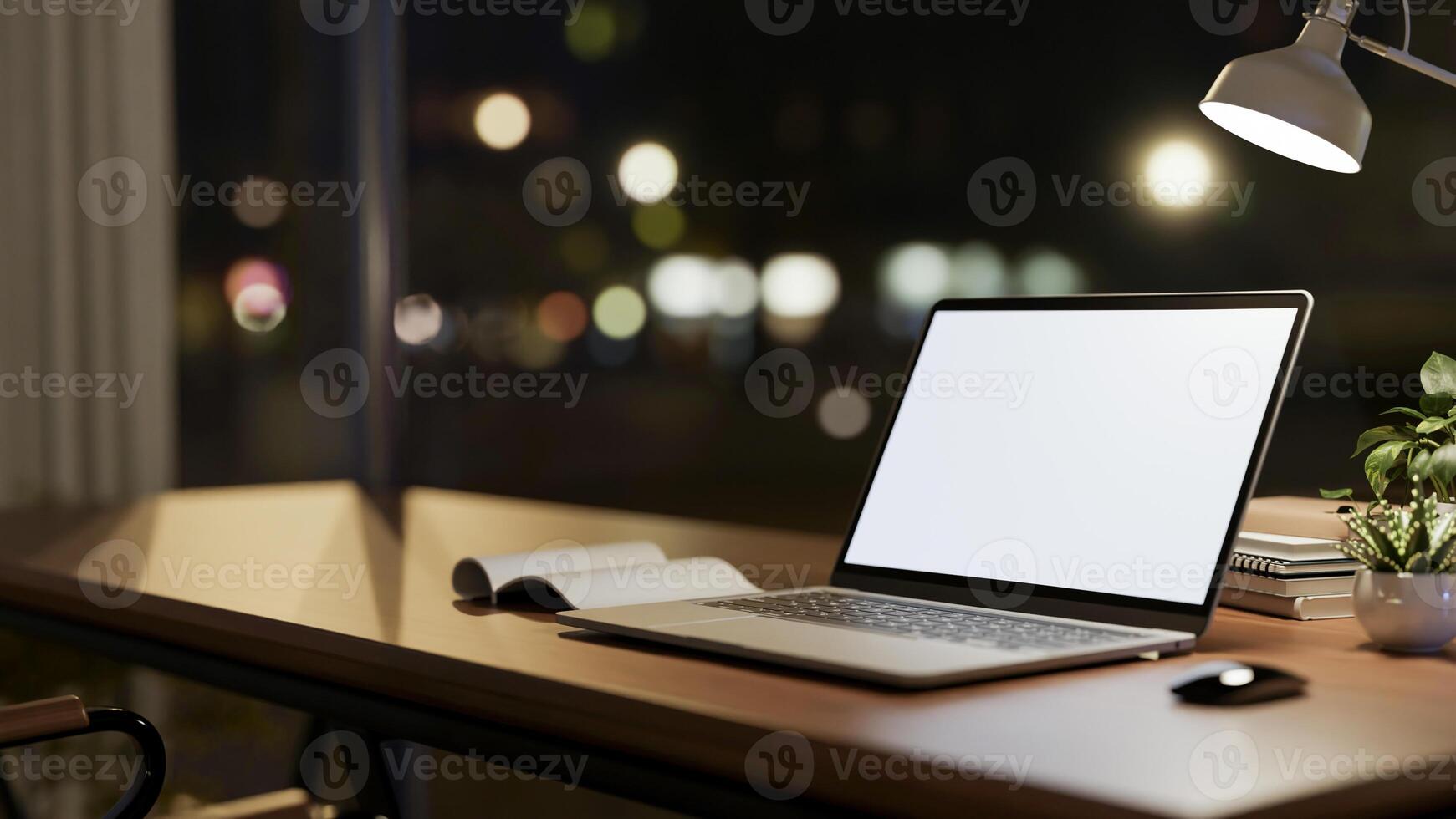 A laptop computer mockup on wooden table against the window with city nightlight view. photo