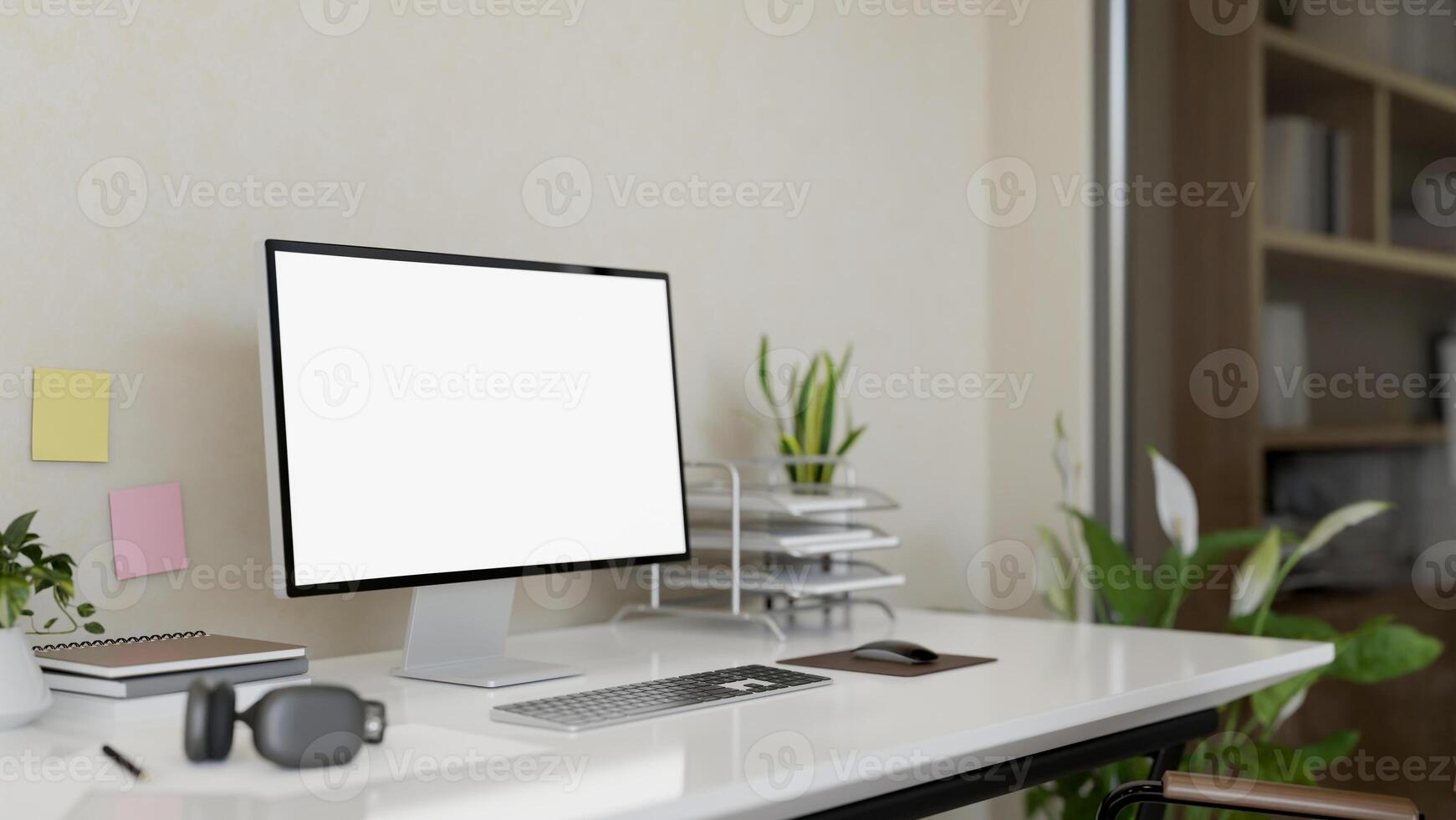 A computer with a white-screen mockup on a desk against the wall in a modern, comfortable office. photo
