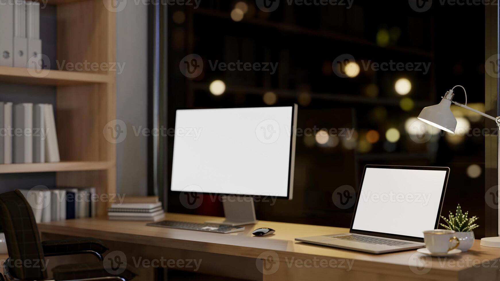 A contemporary luxurious private office at night features a computer and a laptop mockup on a table. photo