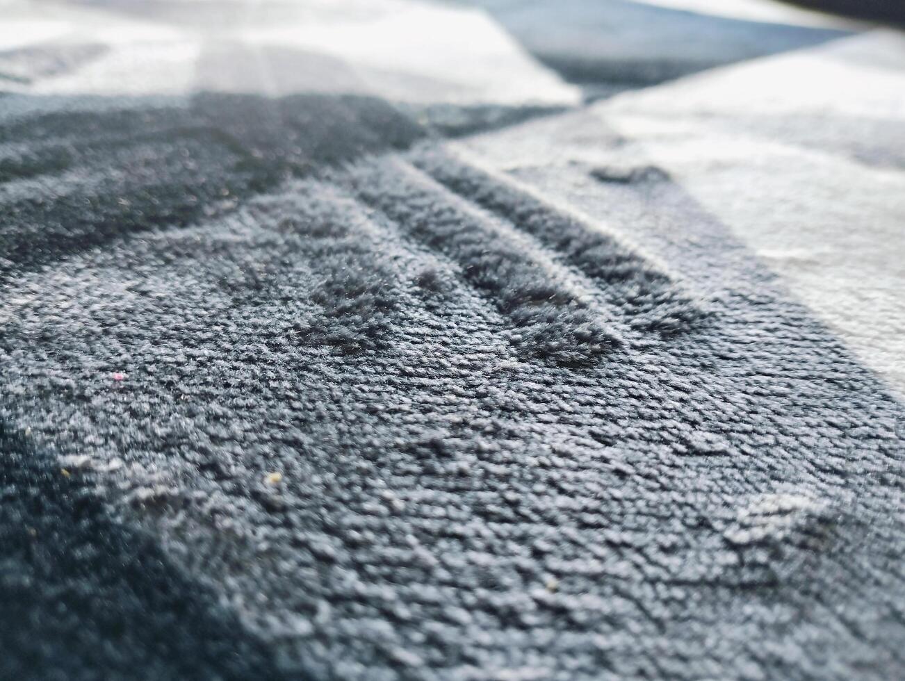 Abstract textured background A close up of a black and white abstract rug, carpet backround photo