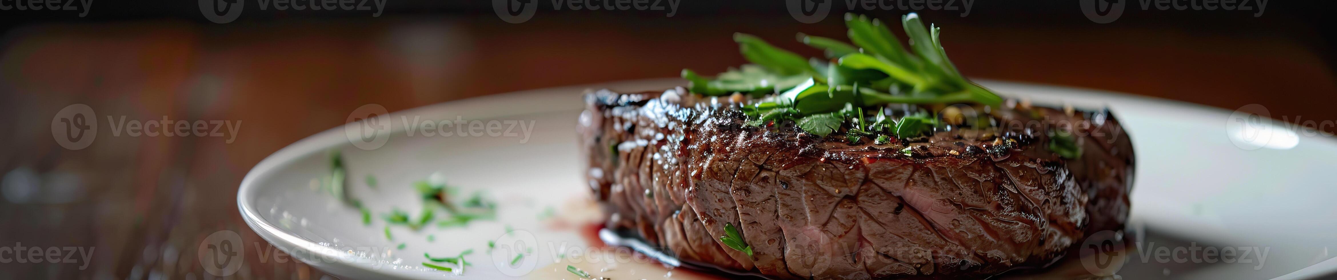 Delicious grilled steak garnished with herbs on a white plate against a dark background, highlighting gourmet dining and culinary excellence. photo
