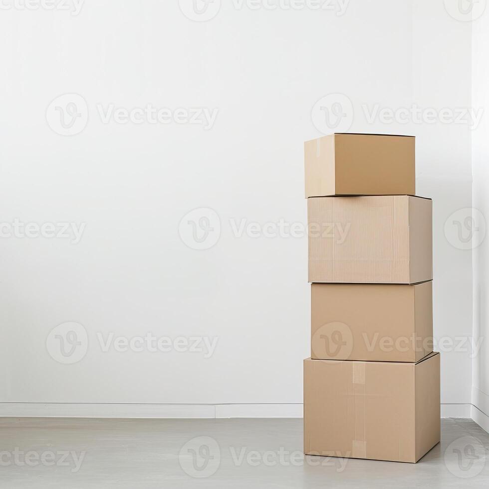 Stack of cardboard boxes against a white wall in an empty room, ideal for moving, storage, or packaging concepts. photo