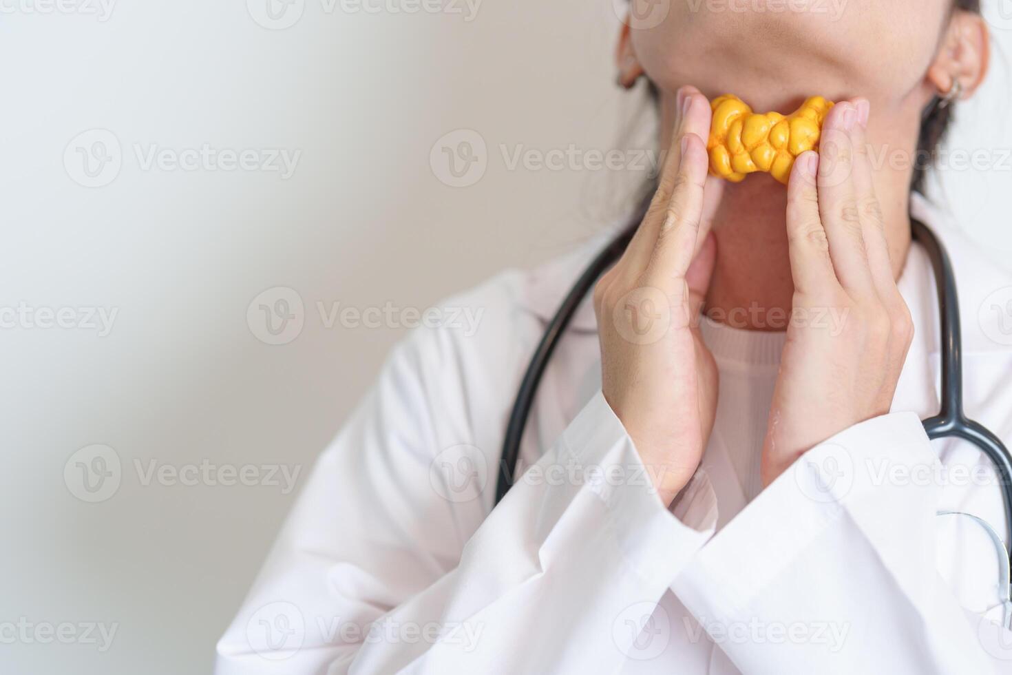 Doctor with human Thyroid anatomy model. Hyperthyroidism, Hypothyroidism, Hashimoto Thyroiditis, Thyroid Tumor and Cancer, Postpartum, Papillary Carcinoma and Health concept photo