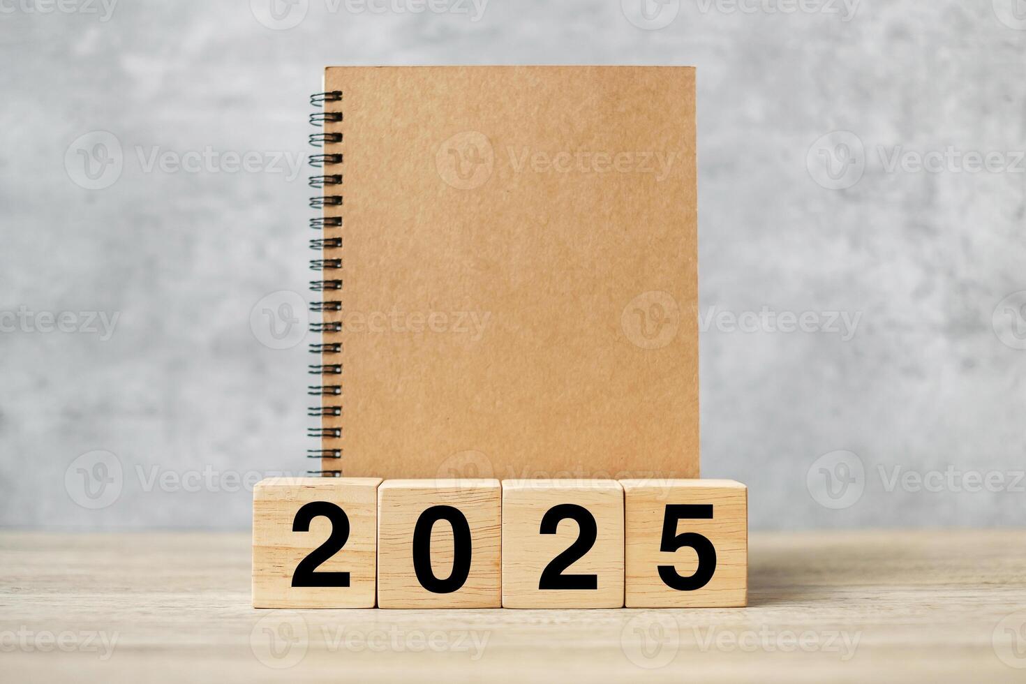 2025 Happy New Year with blank notebook and wooden number. countdown, Resolution, Goals, Plan, Action and Mission Concept photo