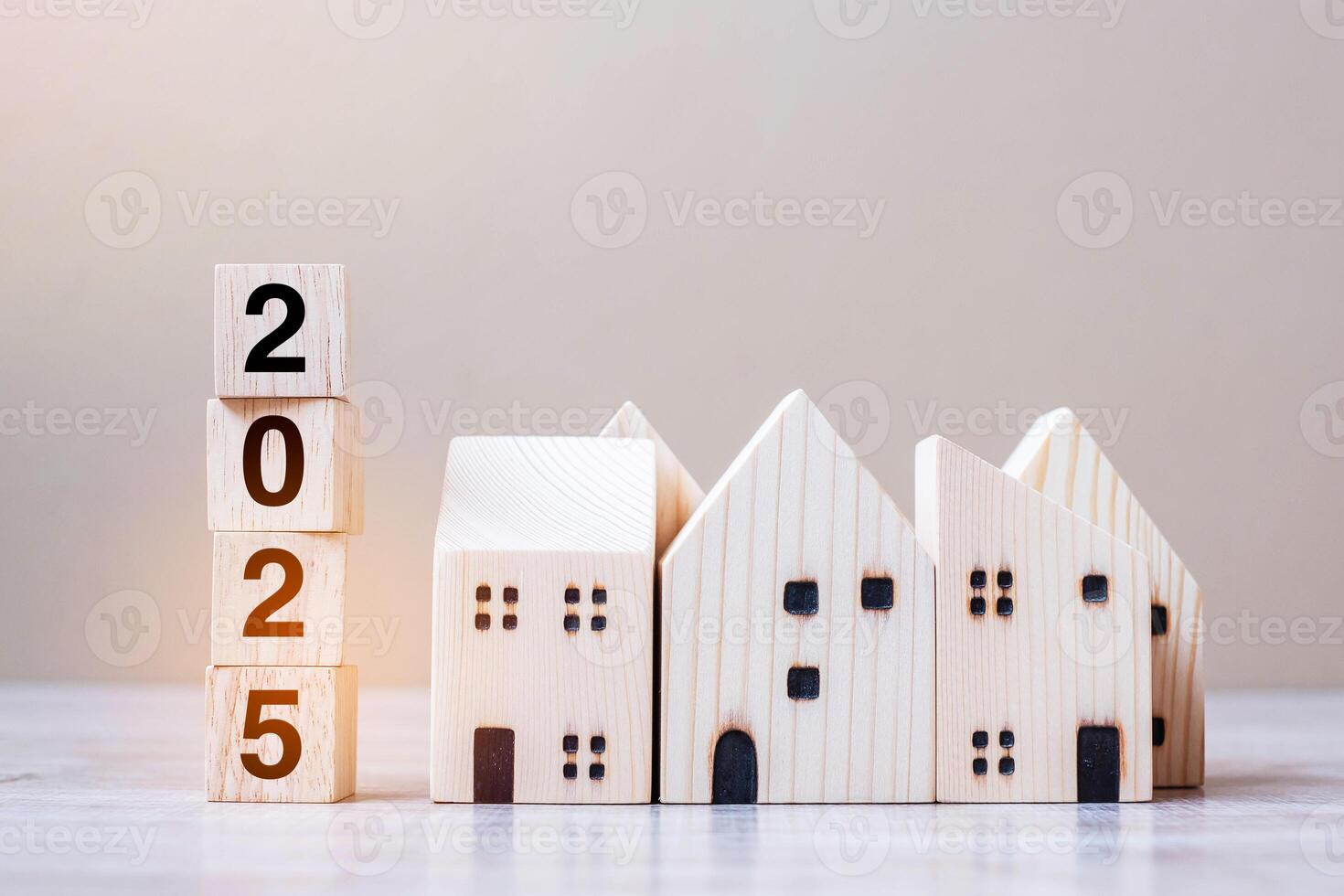 2025 Happy New Year with house model on table wooden background. Banking, real estate, investment, financial, savings and New Year Resolution concepts photo