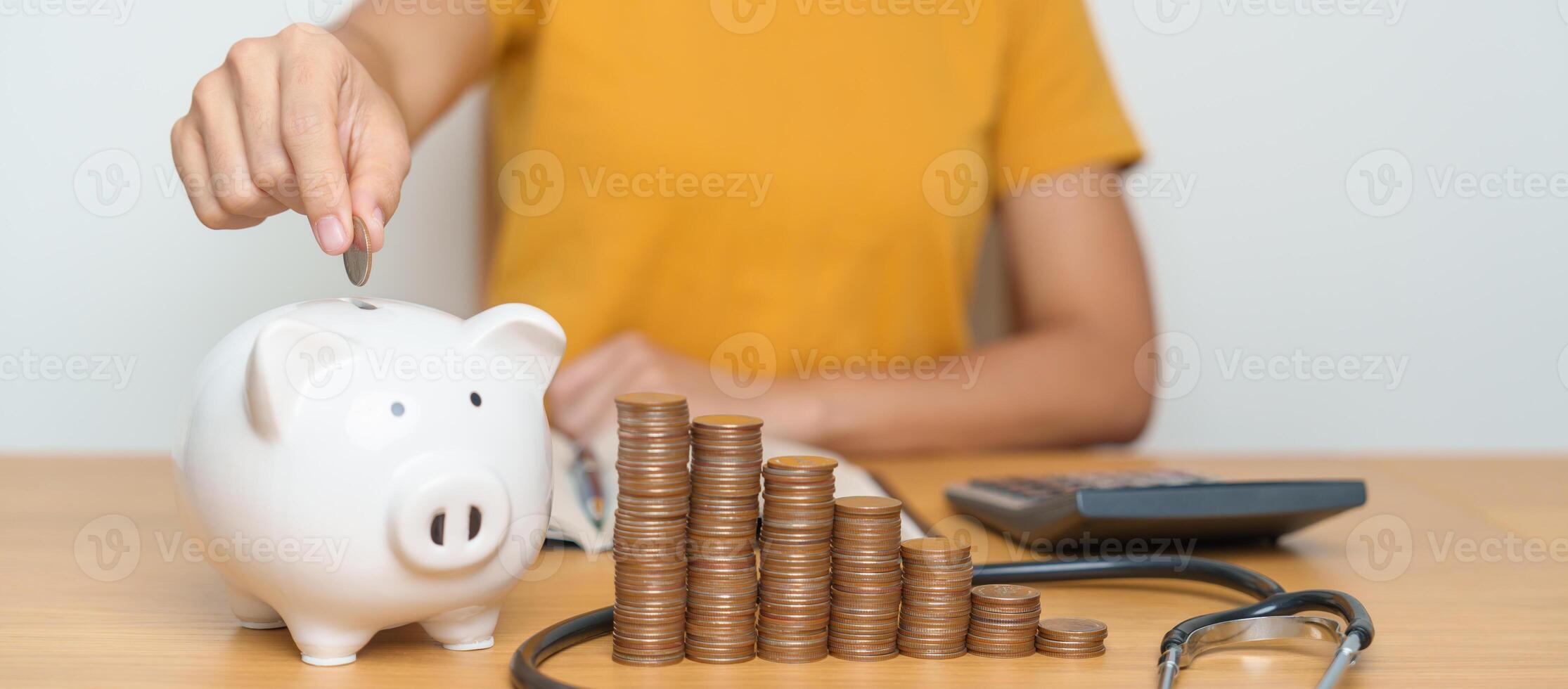 Money Saving, Health Insurance, Medical, Donation and Financial concepts. woman with coins stack and piggy bank and stethoscope, Money stack Counting arrangement for deposit and Healthcare cost photo