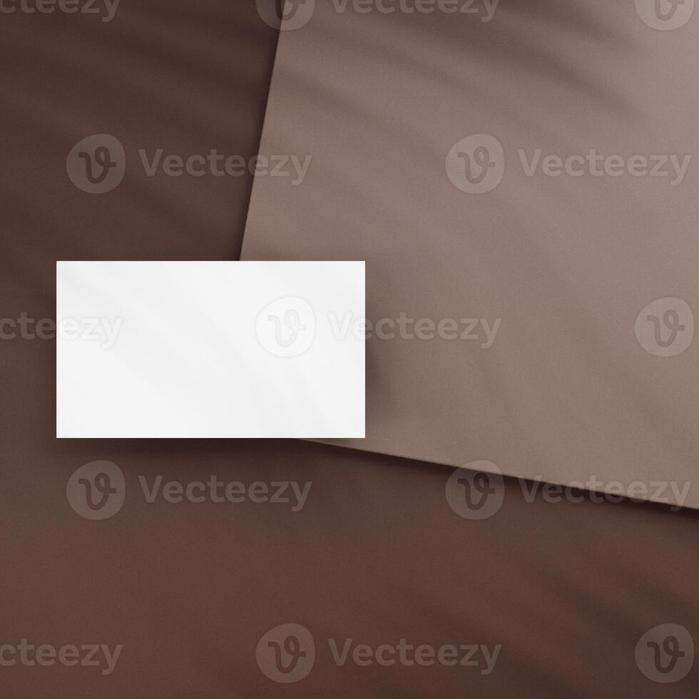 Blank business cards on brown background photo