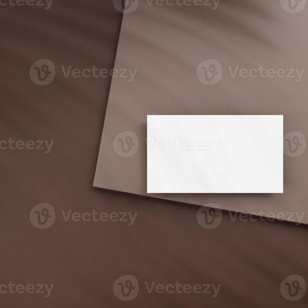 Blank business cards on brown background photo