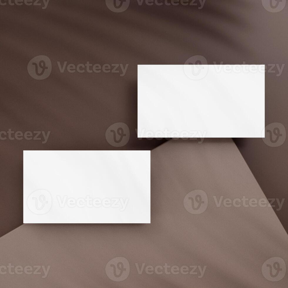 Blank business cards on brown background photo