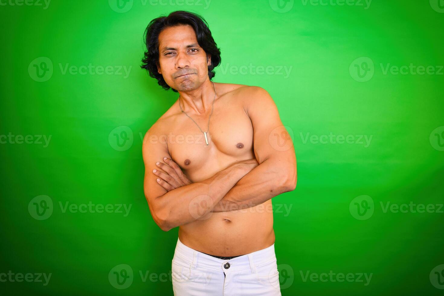 Confident shirtless man with muscular build photo