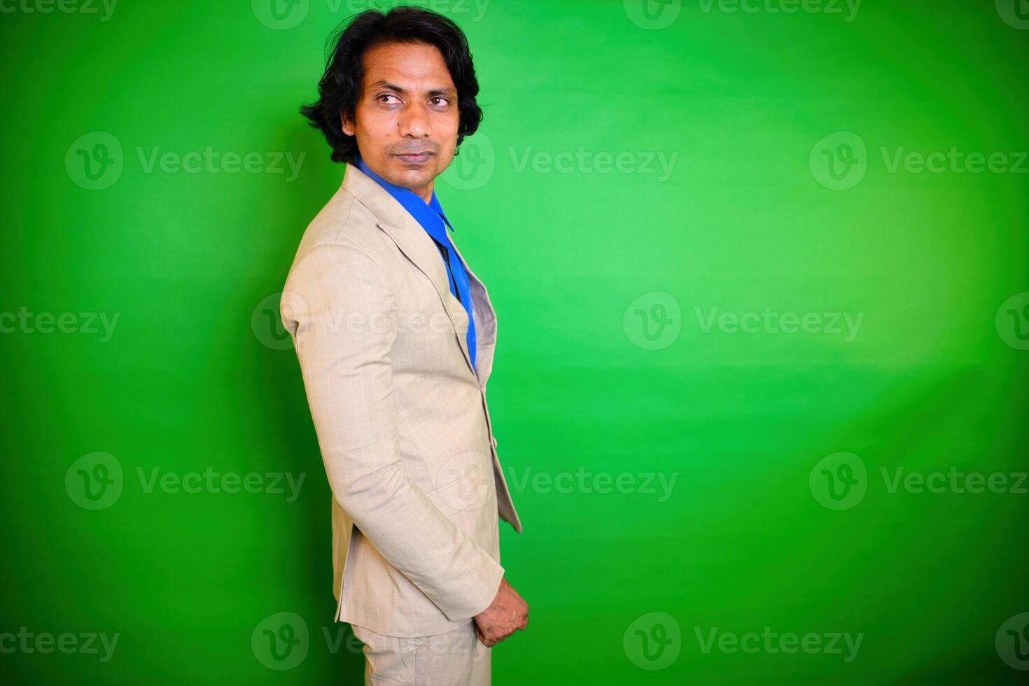 Man in a suit side profile pose photo