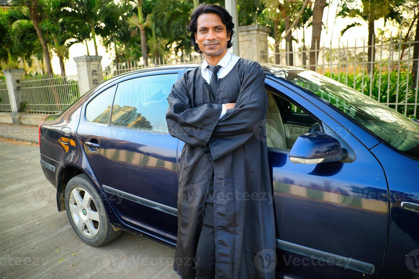 Lawyer standing next to car photo