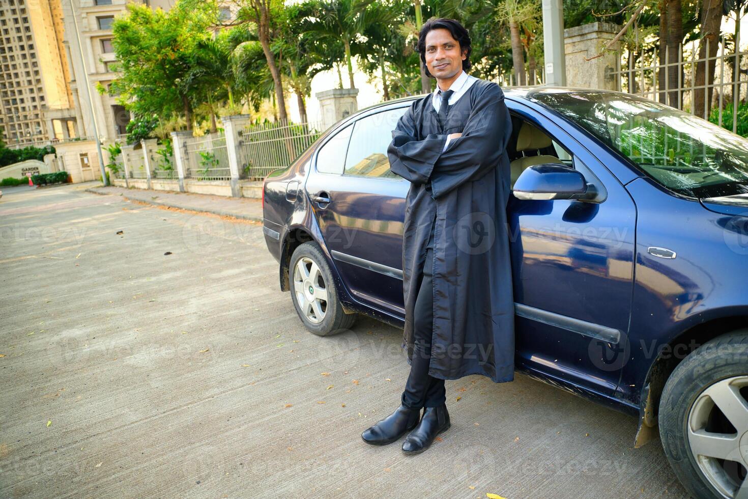 Lawyer standing next to car photo