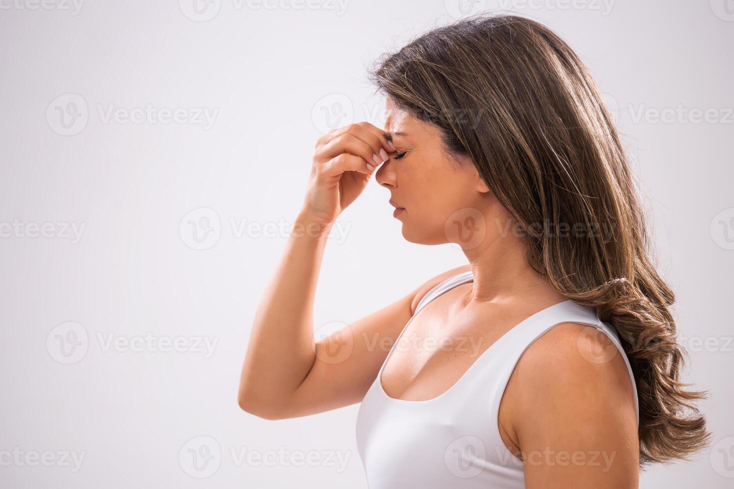 Portrait of adult woman who is having pain in sinus. photo