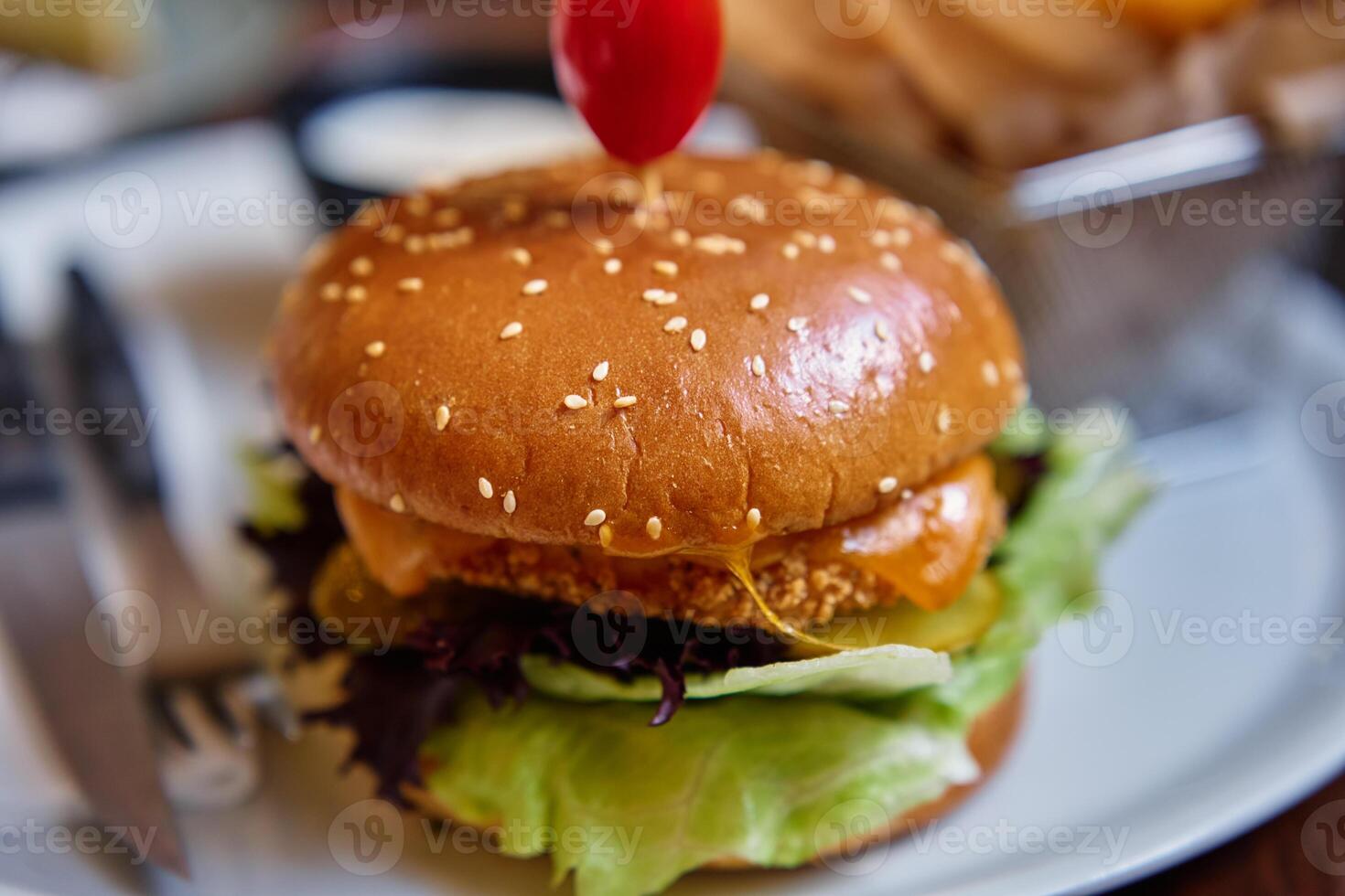 Delicious Chicken Burger and Crispy Fries in Restaurant photo