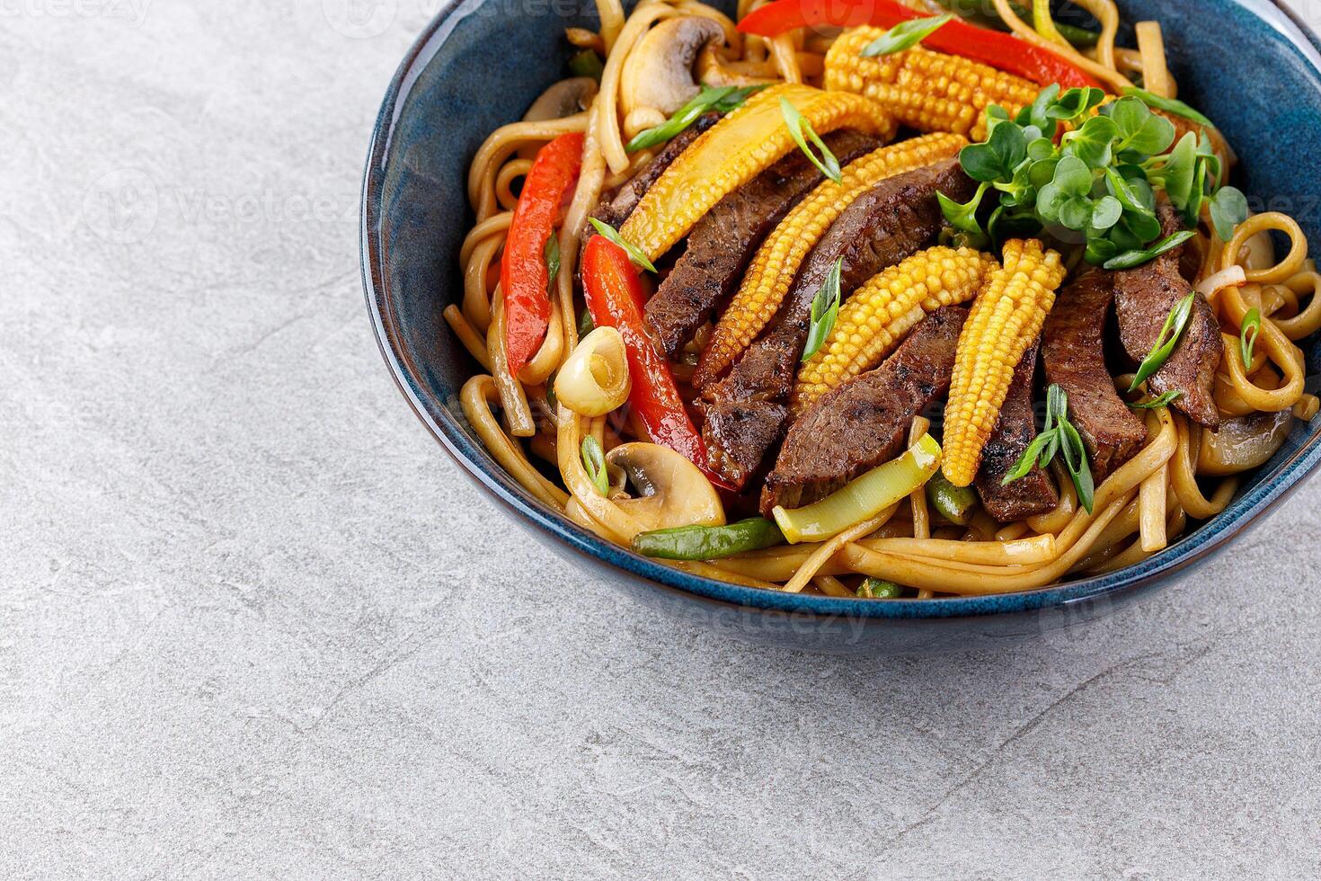 Udon noodles with beef and vegetables for the menu, website, restaurant or food delivery photo