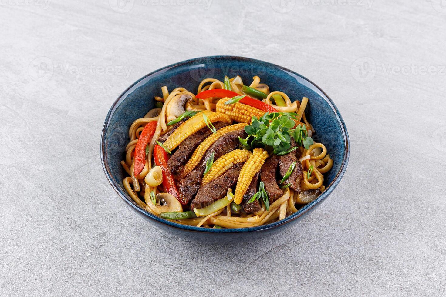 Udon noodles with beef and vegetables for the menu, website, restaurant or food delivery photo