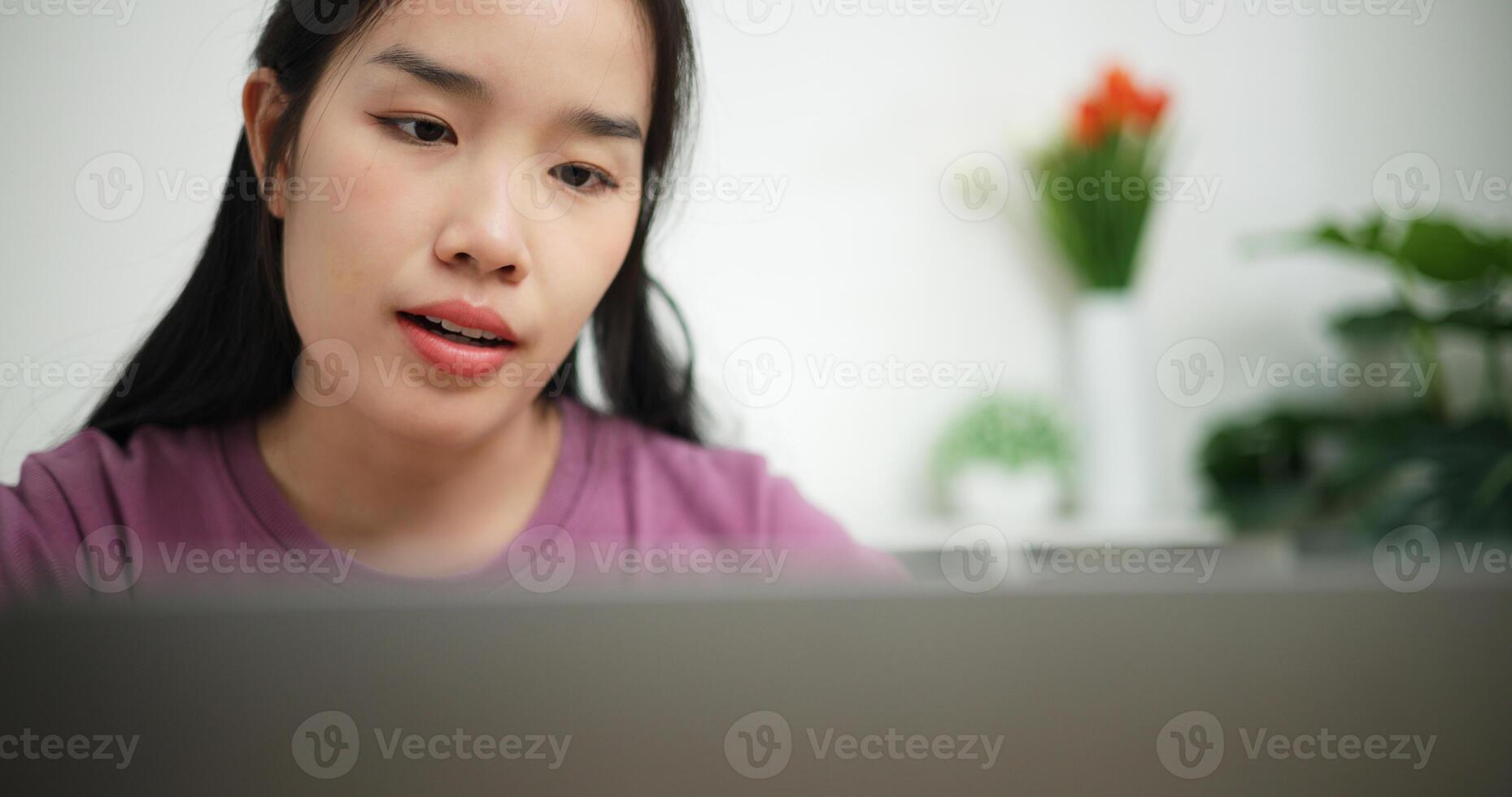 Selective focus, Young asian businesswoman using laptop for conference call presenting project plan to colleagues at home office, online meeting for remote work photo