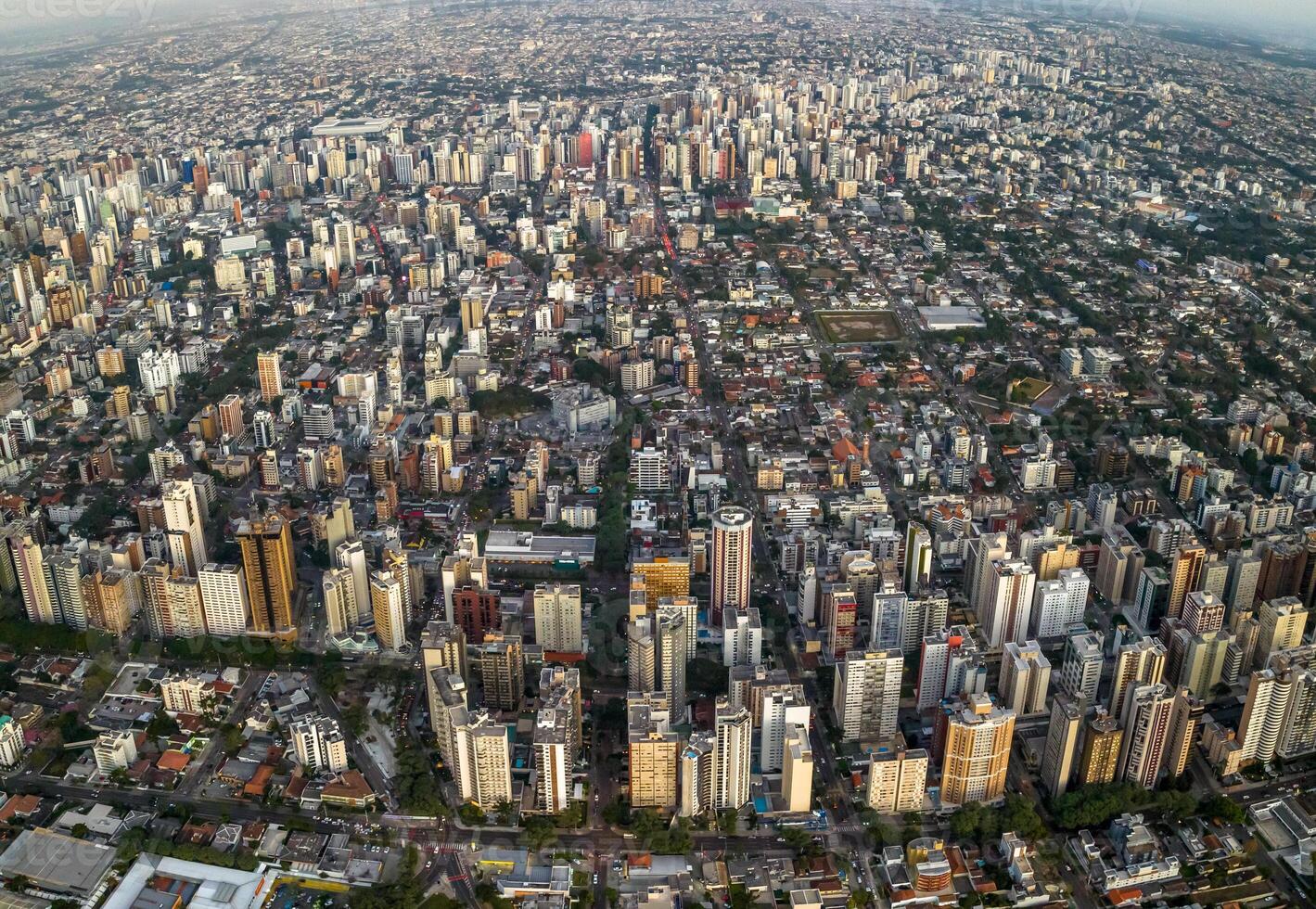 Curitiba in Parana, Brazil. Aerial View. Wonderful sunset with views of buildings and Tangua Park. Lake with reflection. photo