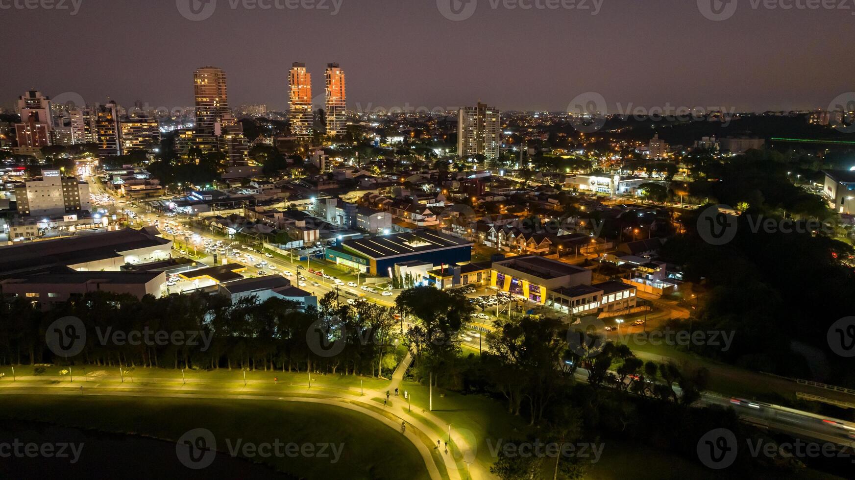 Curitiba in Parana, Brazil. Aerial View. Wonderful sunset with views of buildings and Tangua Park. Lake with reflection. photo