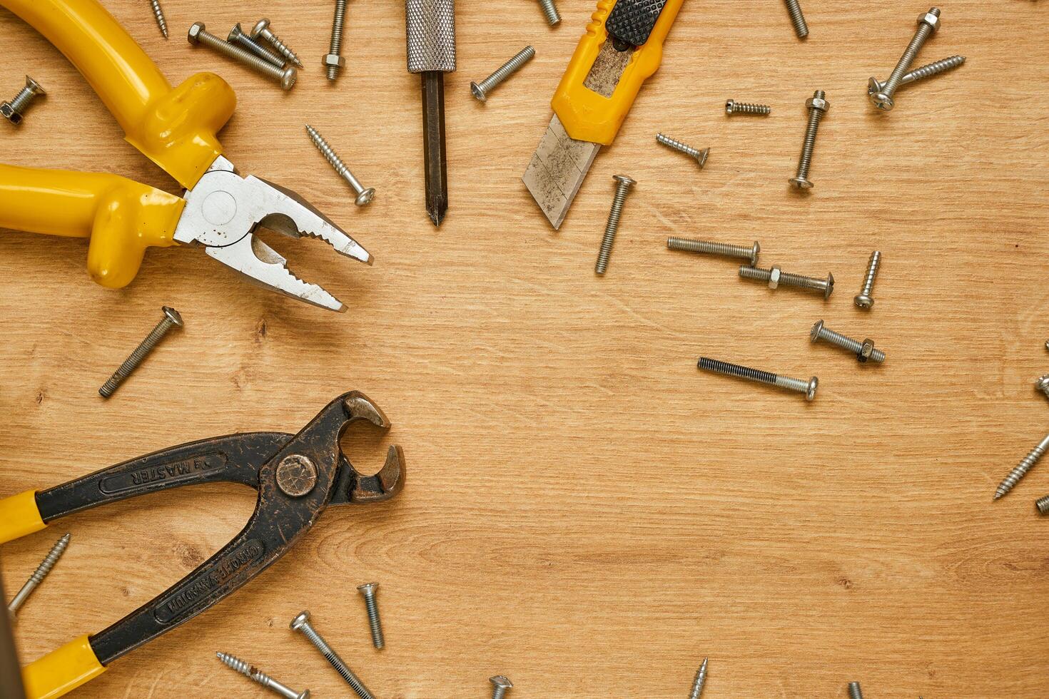 set of hand tools on a wooden surface photo