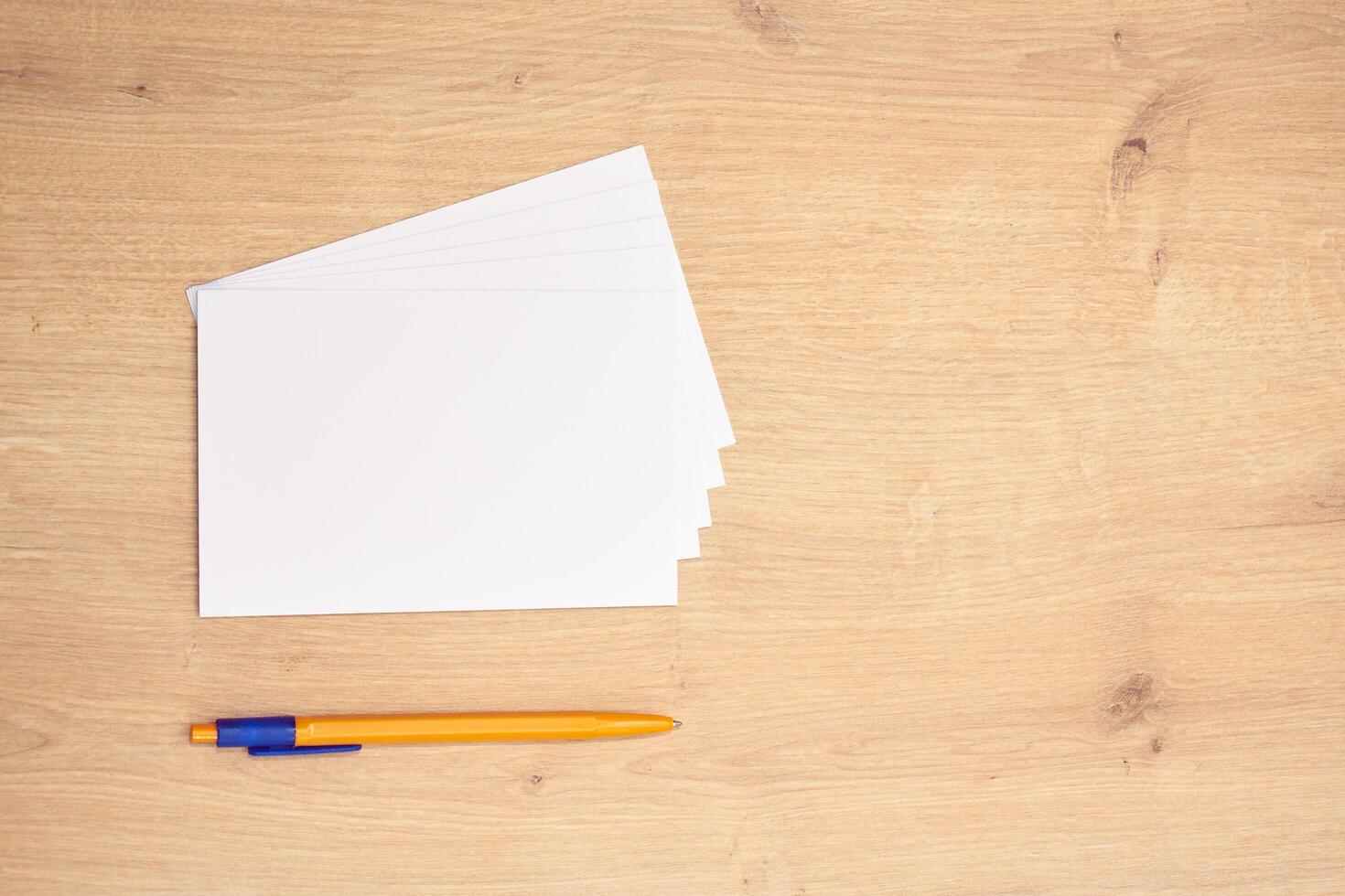 blank a 4 paper and a pen on a table photo