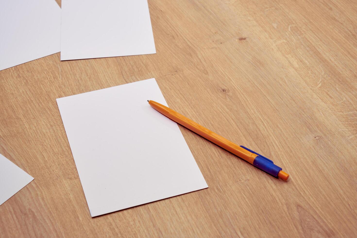 blank a 4 paper and a pen on a table photo
