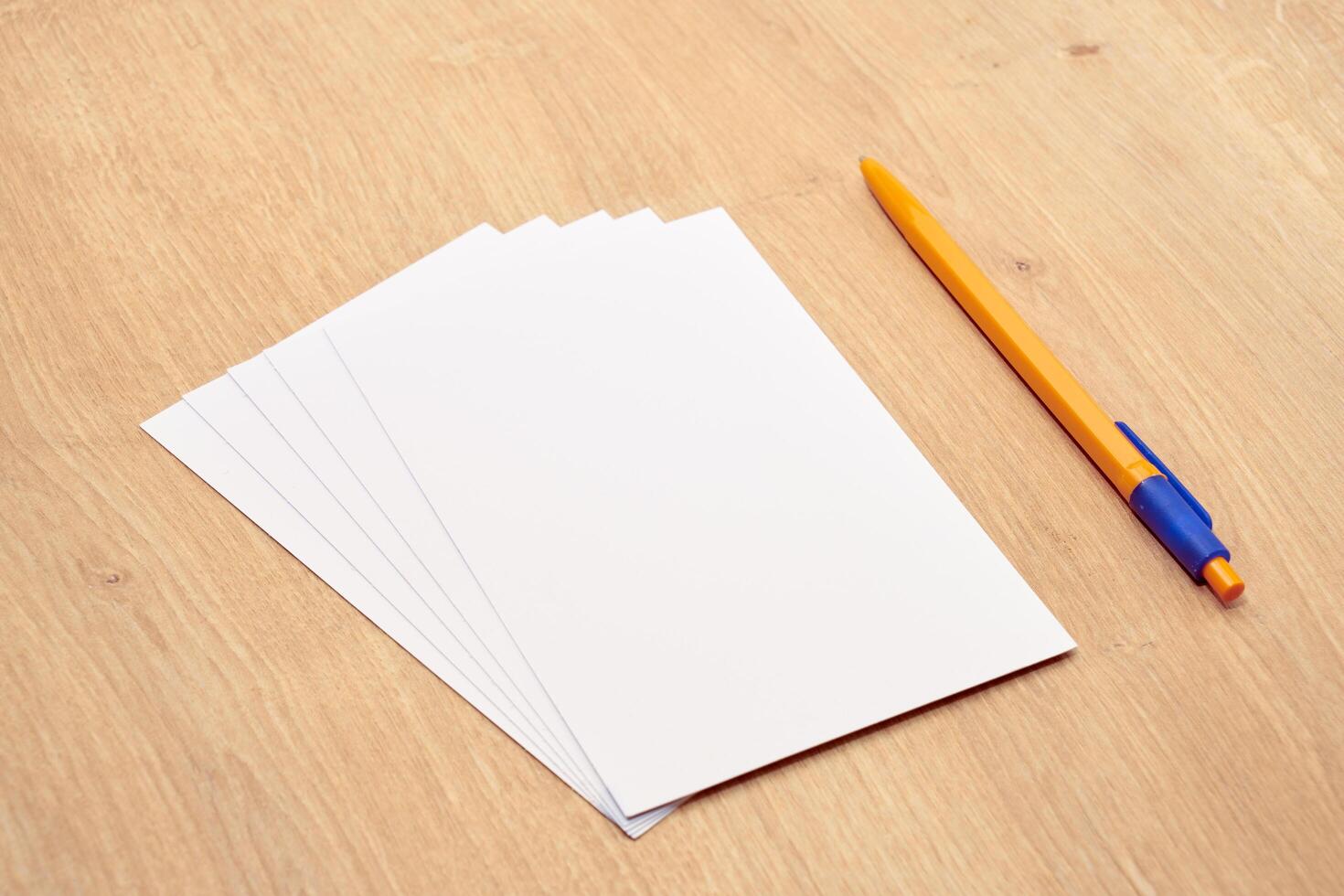 blank a 4 paper and a pen on a table photo