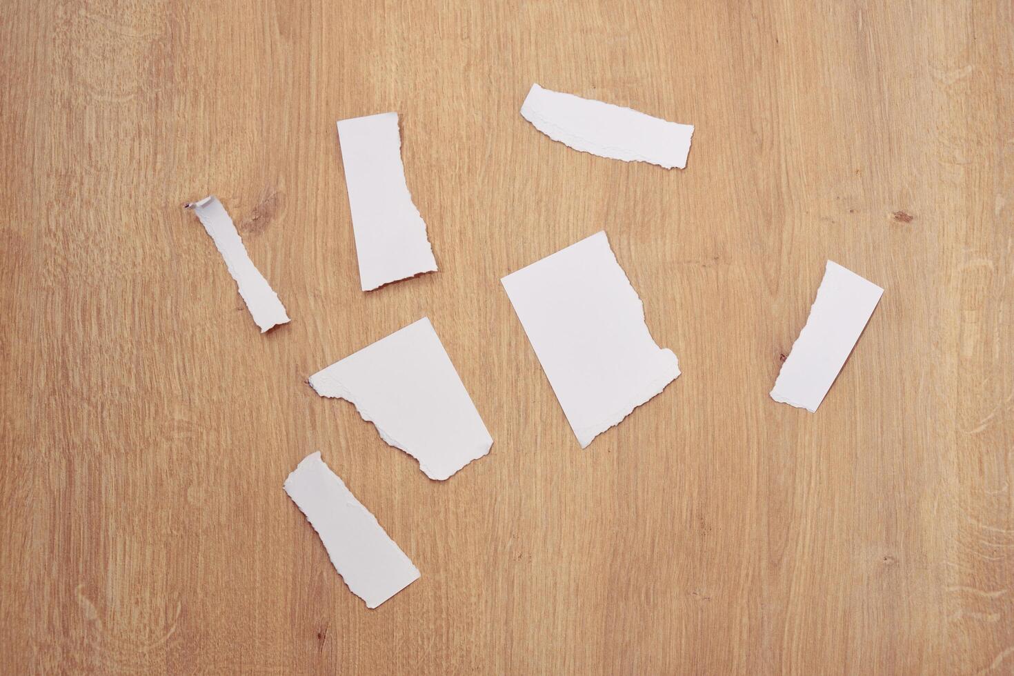 Torn a 4 paper on the table photo