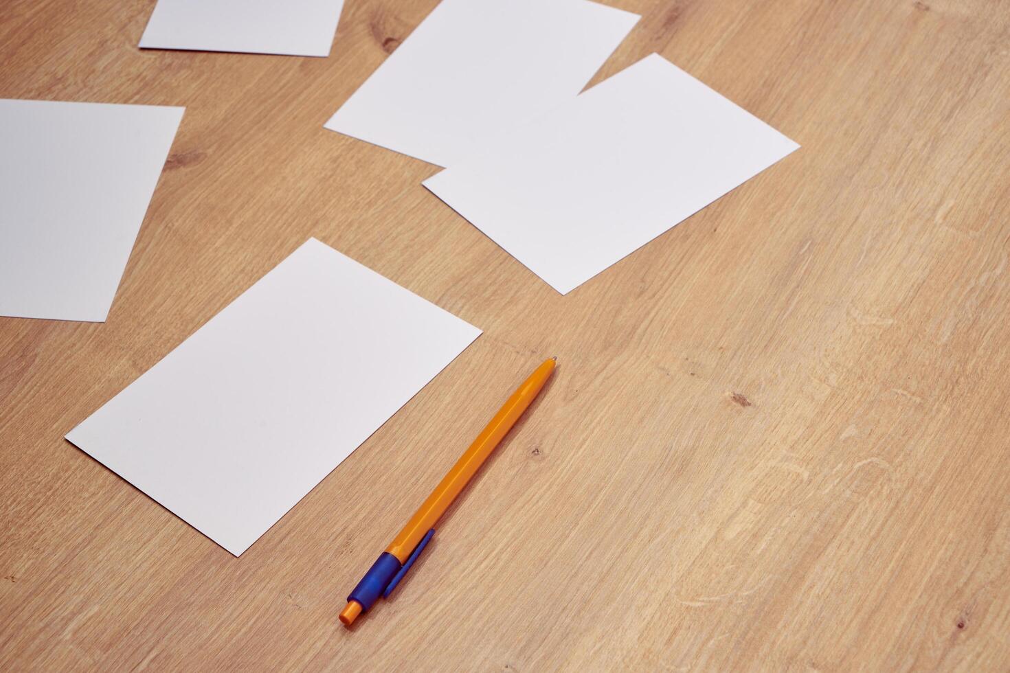 blank a 4 paper and a pen on a table photo