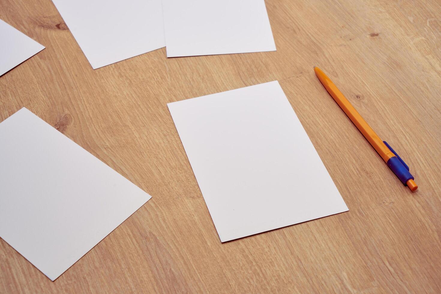 blank a 4 paper and a pen on a table photo