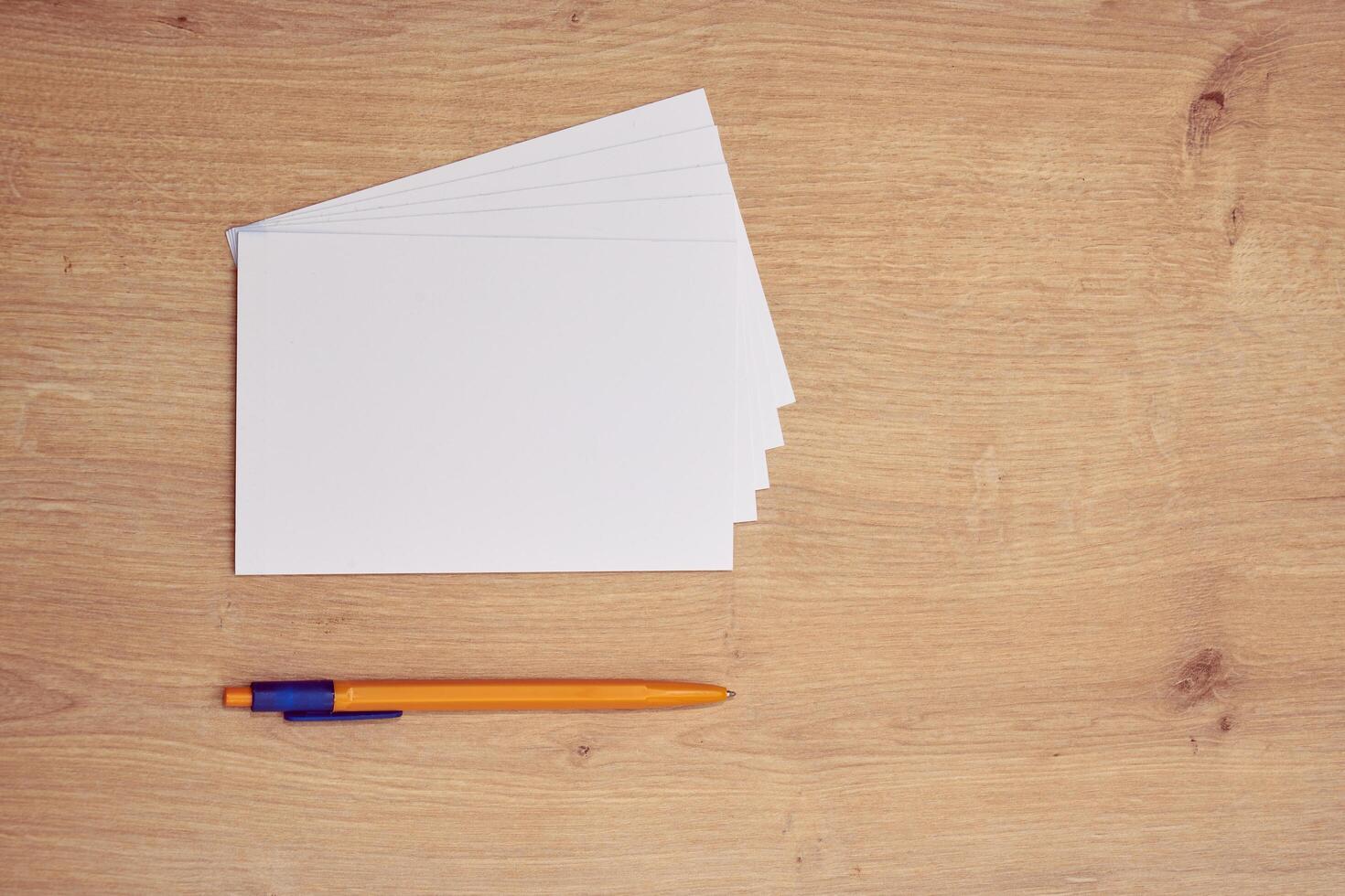 blank a 4 paper and a pen on a table photo