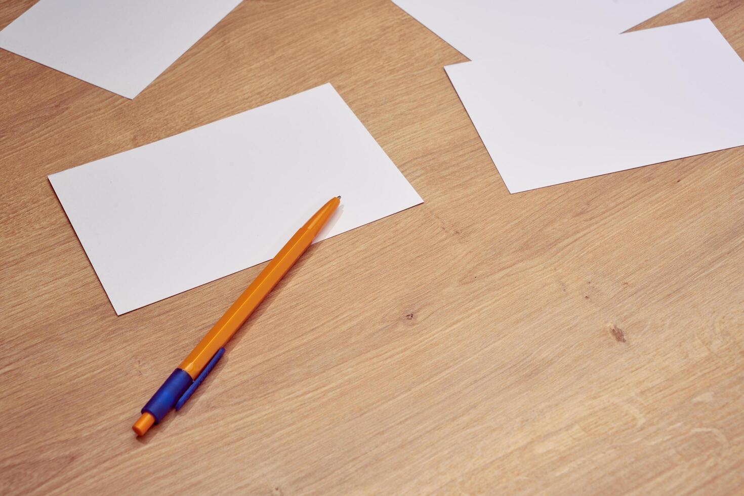 blank a 4 paper and a pen on a table photo
