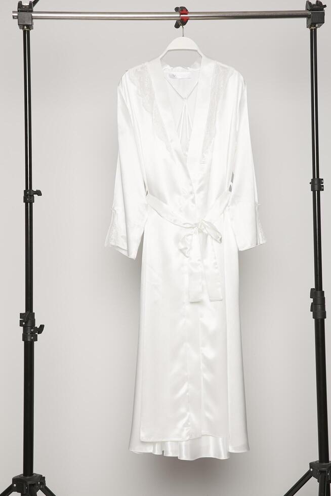 Satin women nighty on a white background. photo